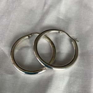 Sterling silver hoop earrings.